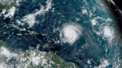 NOAA/Getty Images Satellite image of Hurricane Lee over the Atlantic Ocean