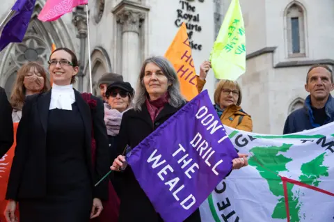 Getty Images Sarah Finch stands with her lawyer outside the court of appeal in 2021