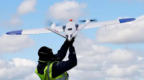 Drone being thrown into the sky