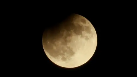 Reuters Partial lunar eclipse at the Samalayuca Dunes on the outskirts of Ciudad Juarez, Mexico