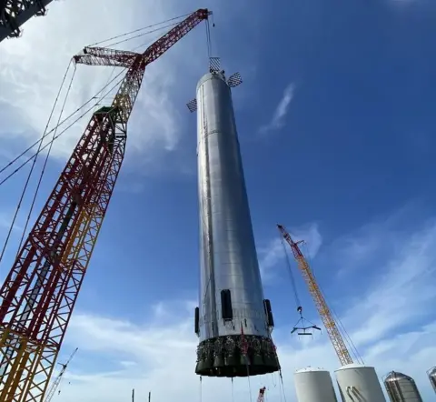 SpaceX A Super Heavy booster is worked on at Starbase in Texas