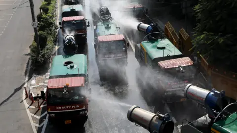 EPA Anti-smog guns spray water mist to curb air pollution in a street of New Delhi, India, 01 November 2024.